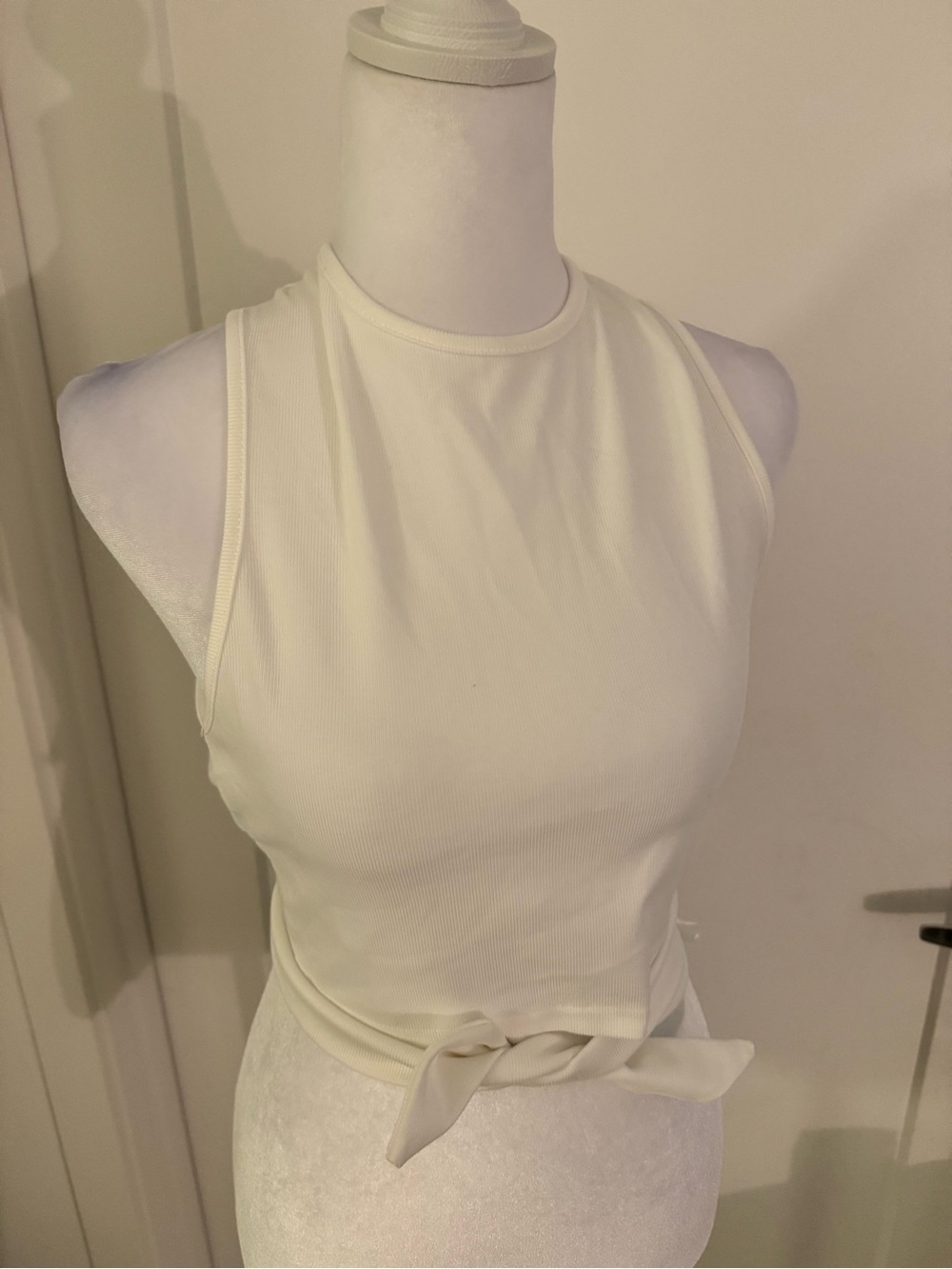 About Us- Women’s Cream Sleeveless Tie-Waist Tank Top